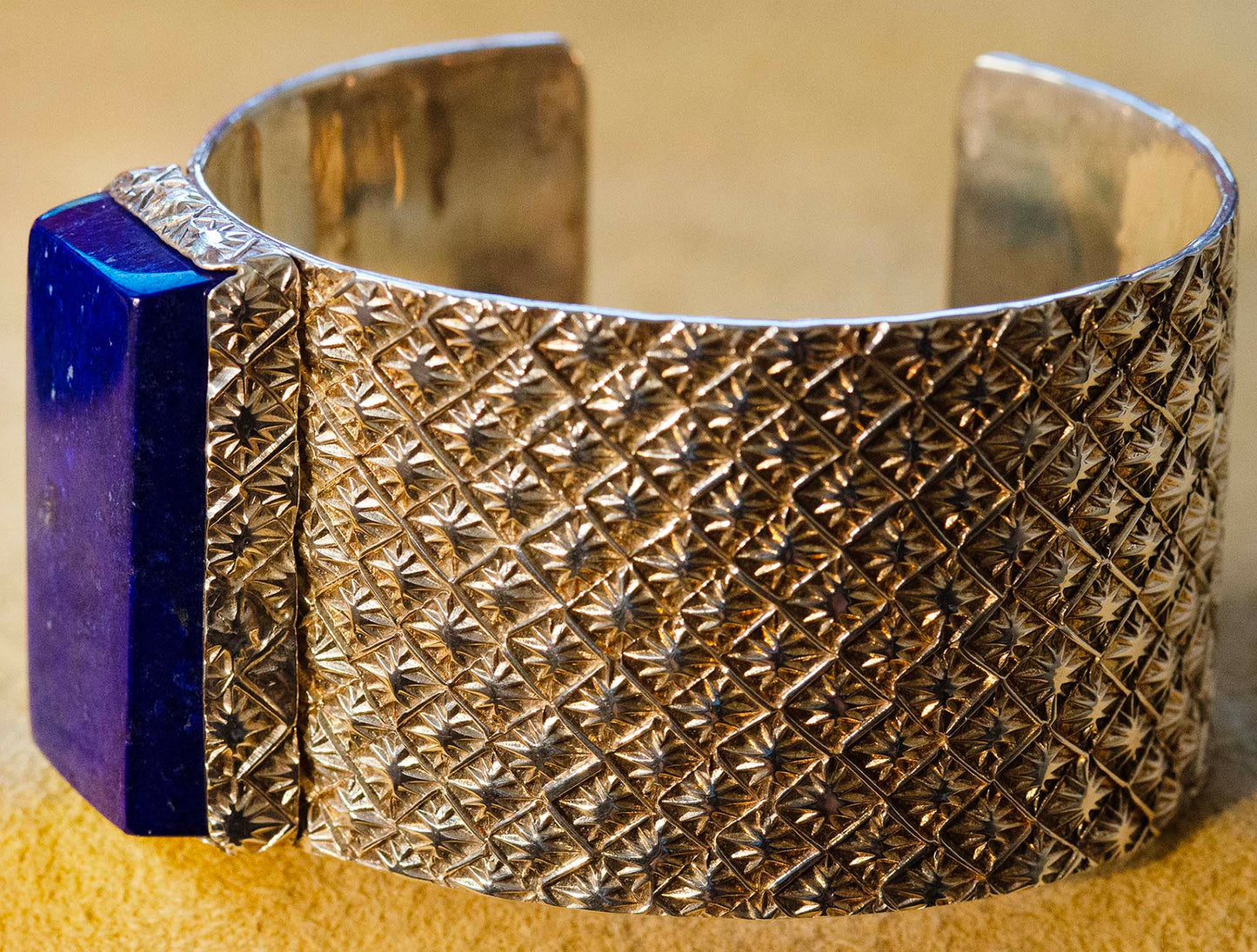 Sam LaFontain, Large Lapis Gem in a Handmade Silver Star Pattern Bracelet