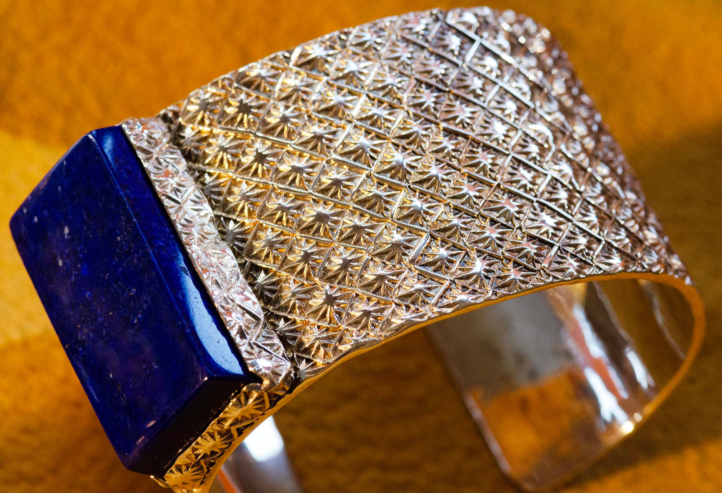 Sam LaFontain, Large Lapis Gem in a Handmade Silver Star Pattern Bracelet