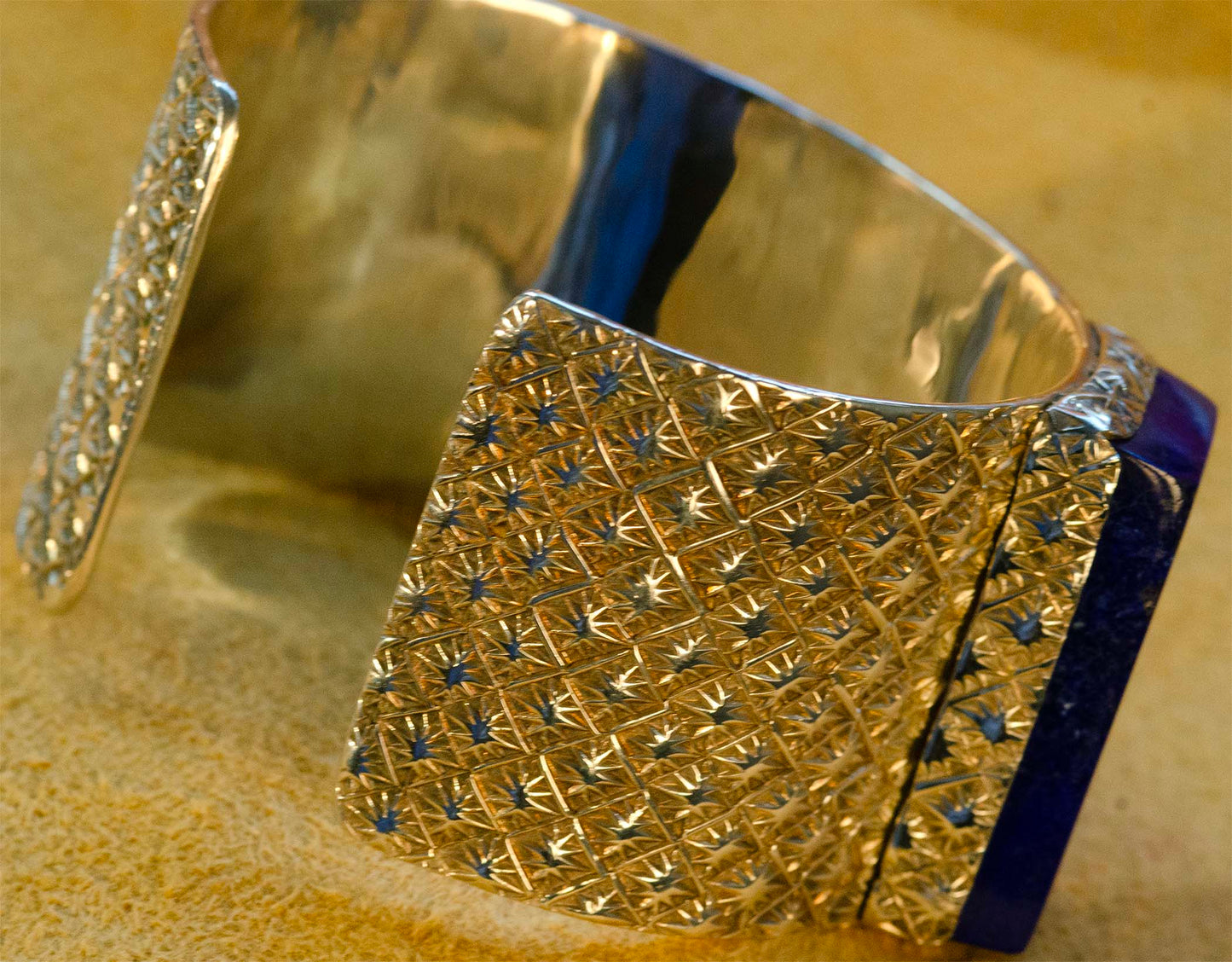 Sam LaFontain, Large Lapis Gem in a Handmade Silver Star Pattern Bracelet